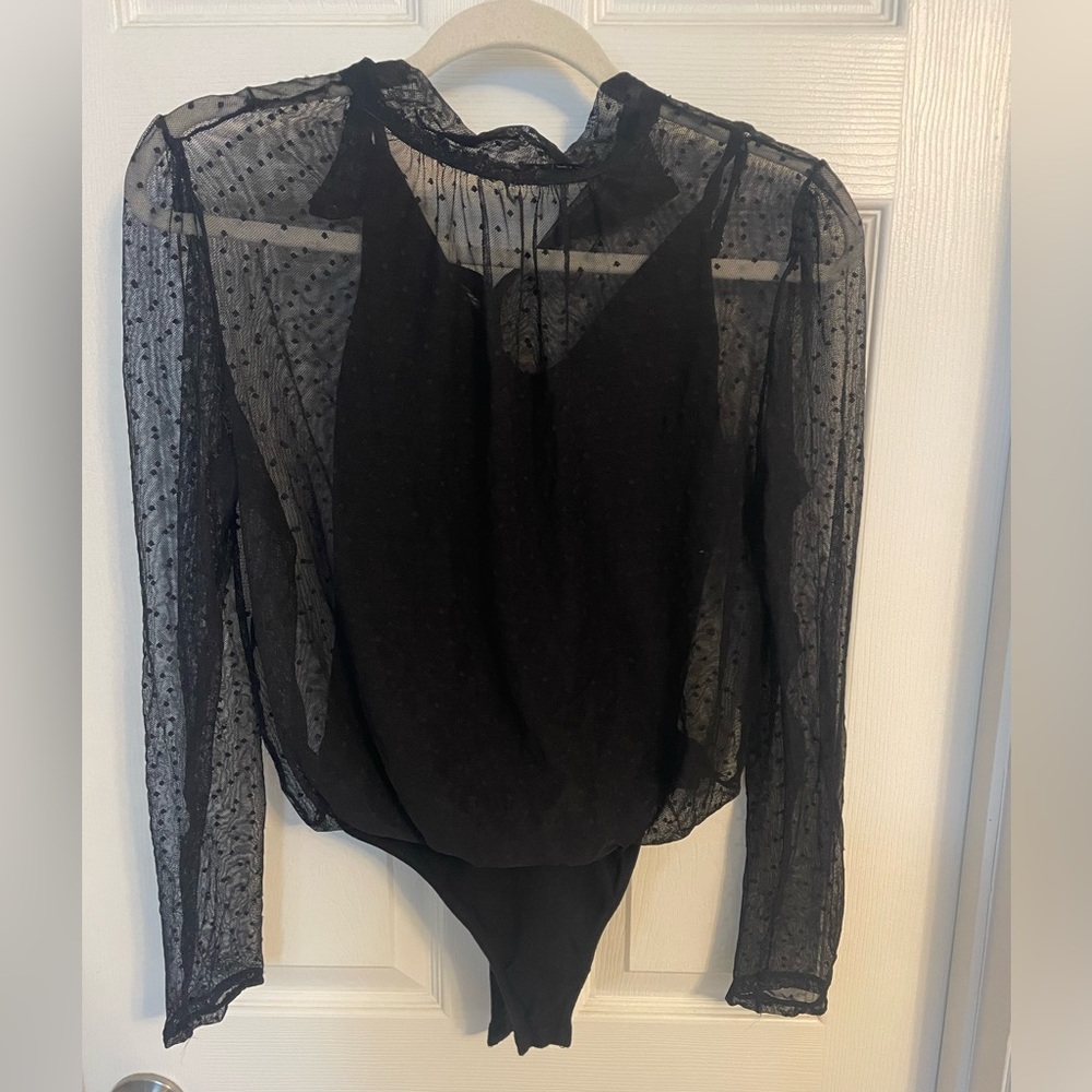 Free People black see through (polka dot) body suit. Size small